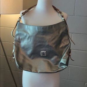 Dooney and Burke gold purse.